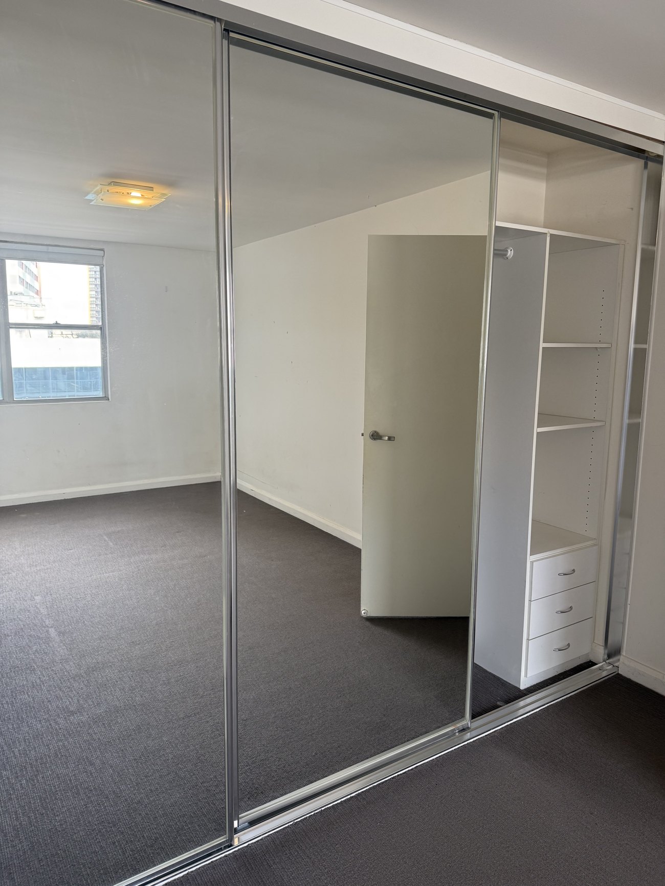 Bedroom with mirrored built-in robe, carpet cleaned